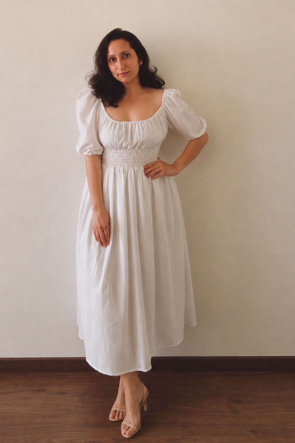 Woman wearing Dawn White Cotton Smocked Waist Midi Dress.