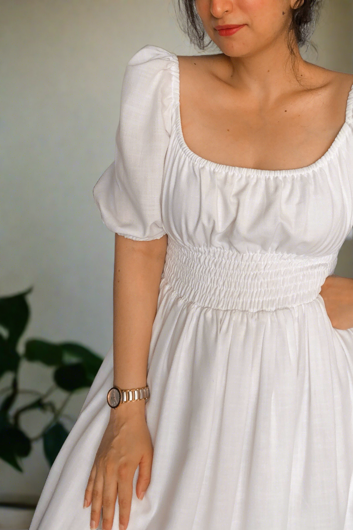 Dawn White Cotton Smocked Waist Midi Dress has smocking around the waist for ease of wearing and elastic on the shoulder and neckline.it is fully lined. Made in pure cotton