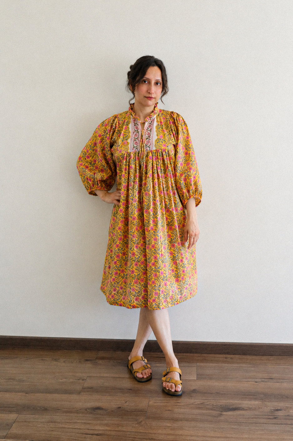 Woman wearing Evening Blush Midi Dress in Mustard Floral Handblock Sanganeri Cotton.