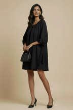 Calm Night Mini Dress in Midnight Black 100% pure silk, gathered neckline, tie sleeve and relaxed silhouette, side view