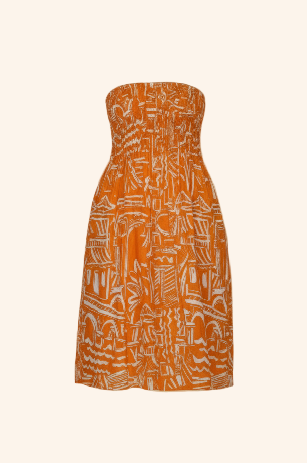 Orange strapless dress with white geometric pattern on a beige background