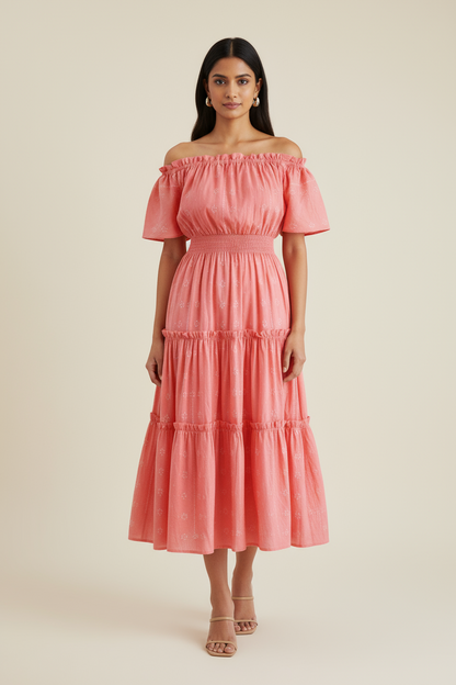 Woman wearing a pink off-shoulder dress against a beige background