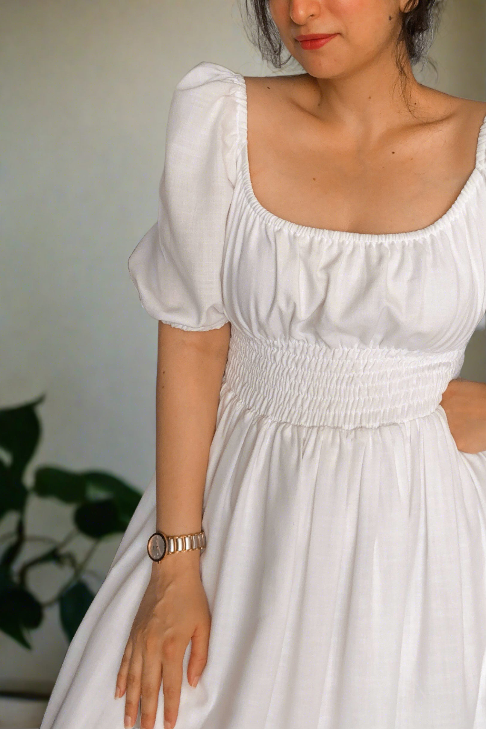 white cotton midi dress with smocking around the waist for ease of wearing and elastic on the shoulder and neckline.it is fully lined. light and floaty