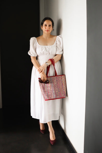 white cotton midi dress with smocking around the waist for ease of wearing and elastic on the shoulder and neckline.it is fully lined. light and floaty