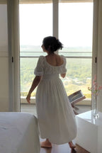 Dawn White Cotton Smocked Waist Midi Dress has smocking around the waist for ease of wearing and elastic on the shoulder and neckline.it is fully lined. light and floaty