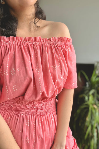 A gorgeous pink colour midi-length dress in pure mulmul that features a flattering shirred waist and a tiered silhouette. Wear it on or off the shoulders, depending upon your mood-looks great either way